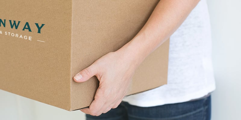 Person holding Steinway moving box